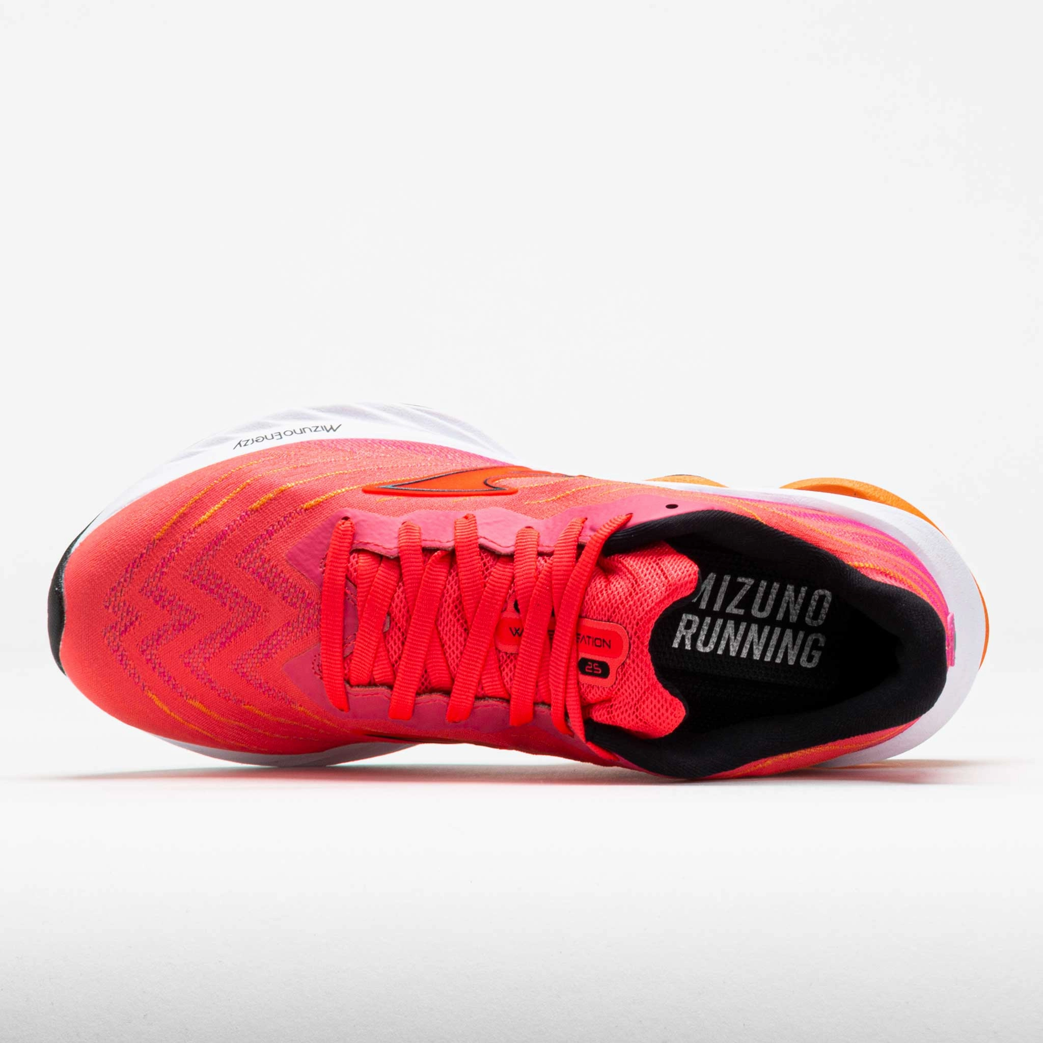 Mizuno Wave Creation 25 Women's  Pink Tetra/Athena running in a volcanic area shoes