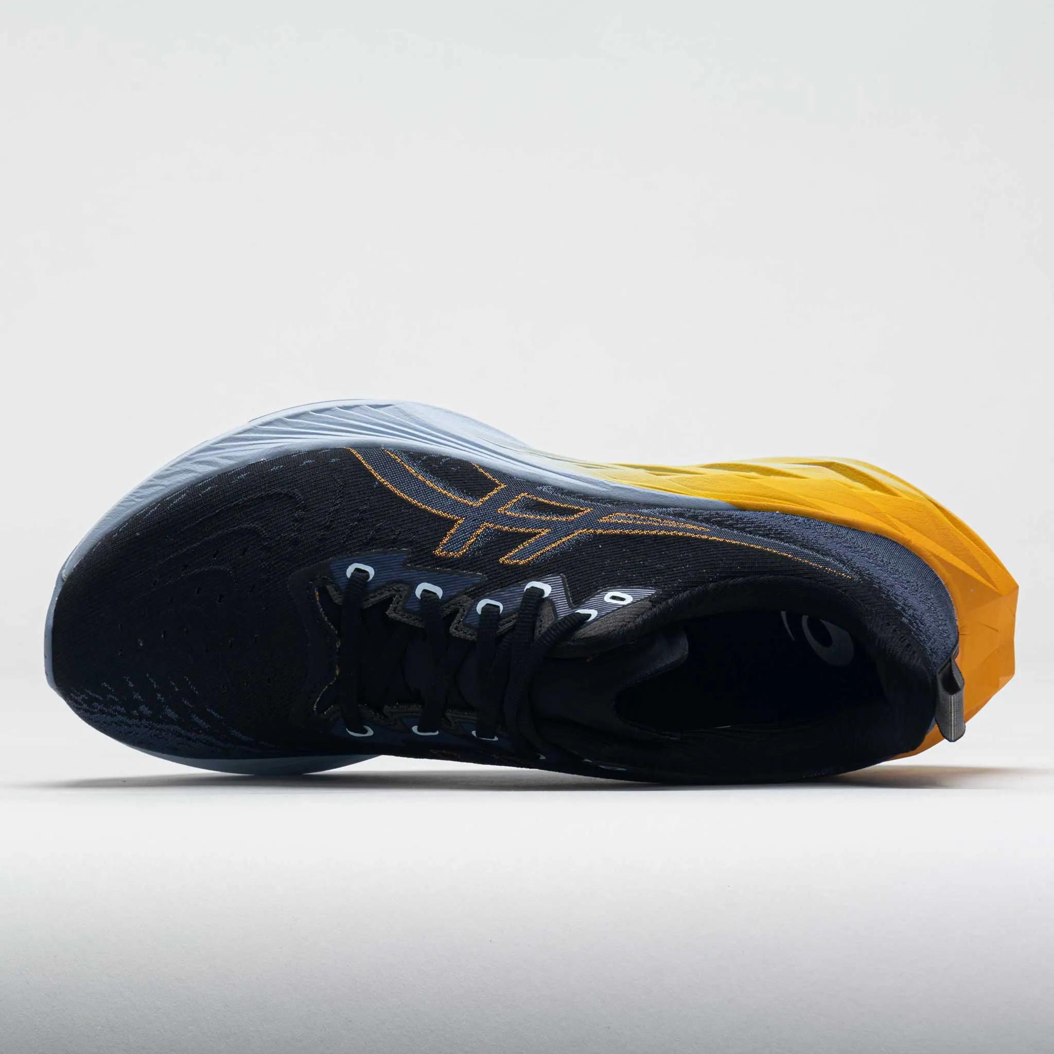 ASICS Novablast 4 Men's  Black/Thunder Blue early - morning running in a rope bridge area shoes