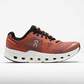 On Cloudgo Men's  Mahogany/Ivory running in a canyon area shoes