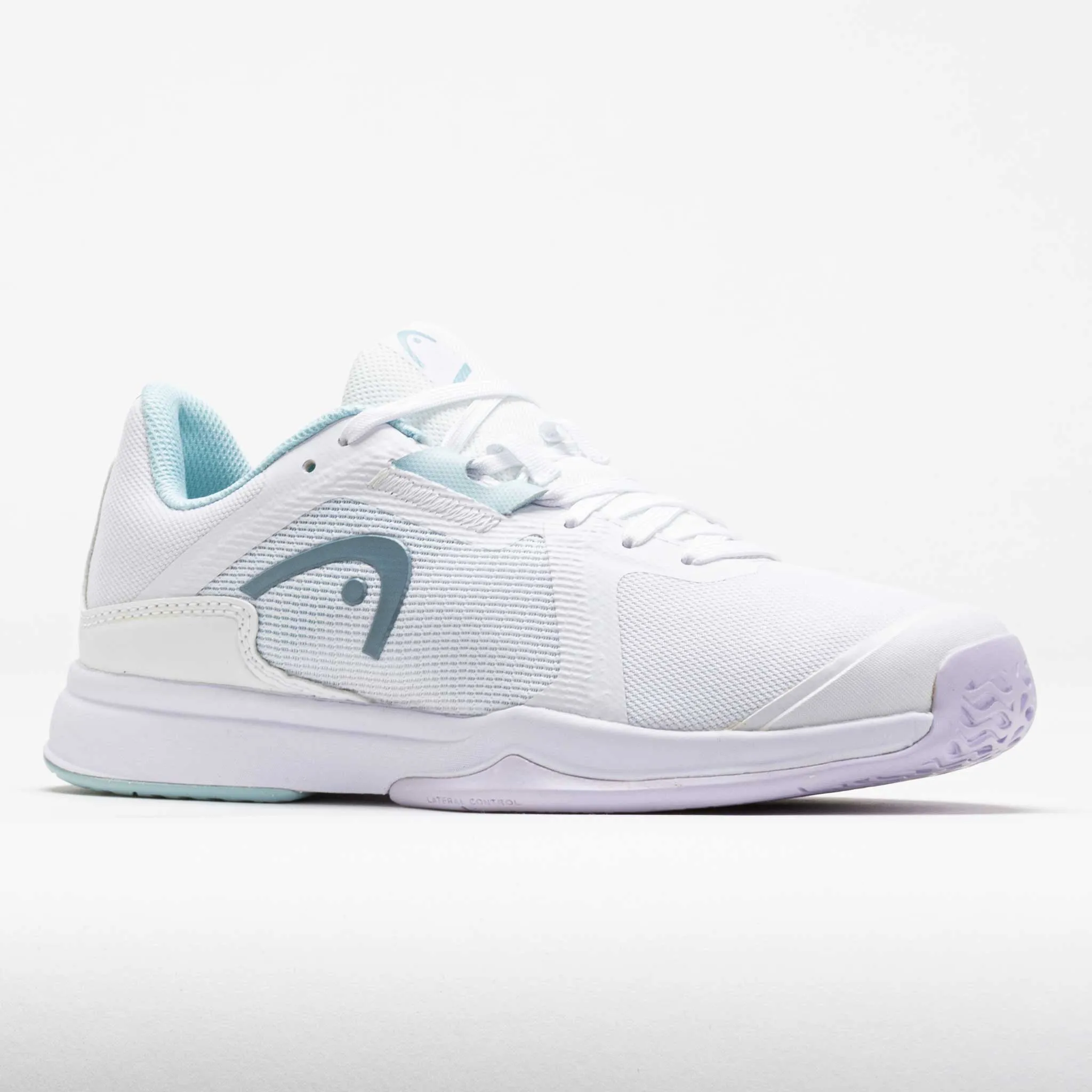 HEAD Sprint Team 3.5 Women's  White/Aqua running on a grass track shoes Cutting - edge