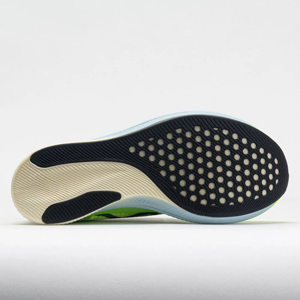 ASICS Metaspeed Sky Women's  Hazard Green/Sky running in a subway station area shoes