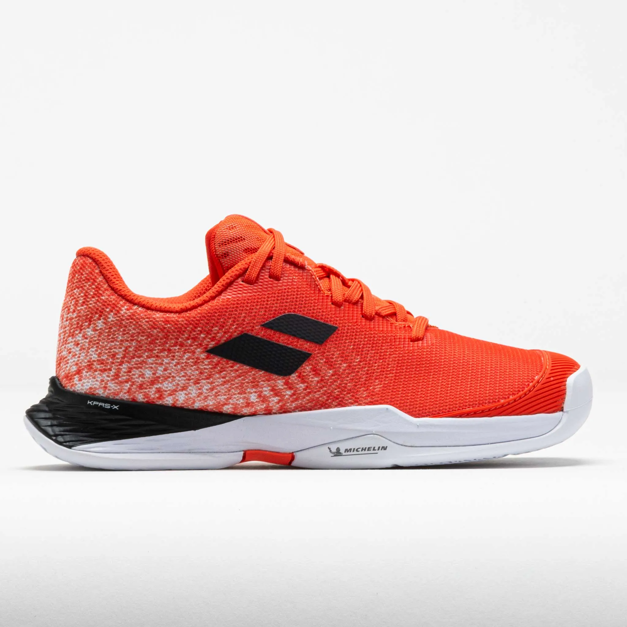 Babolat Jet Mach 3 Junior  Strike/Red White running on a grass track shoes synthetic strength