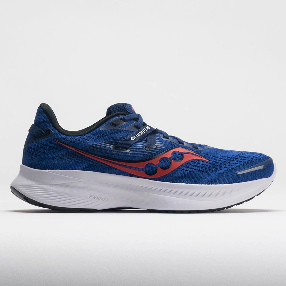 running in a tennis court area shoes Saucony Guide 16 Men's  Indigo/Black